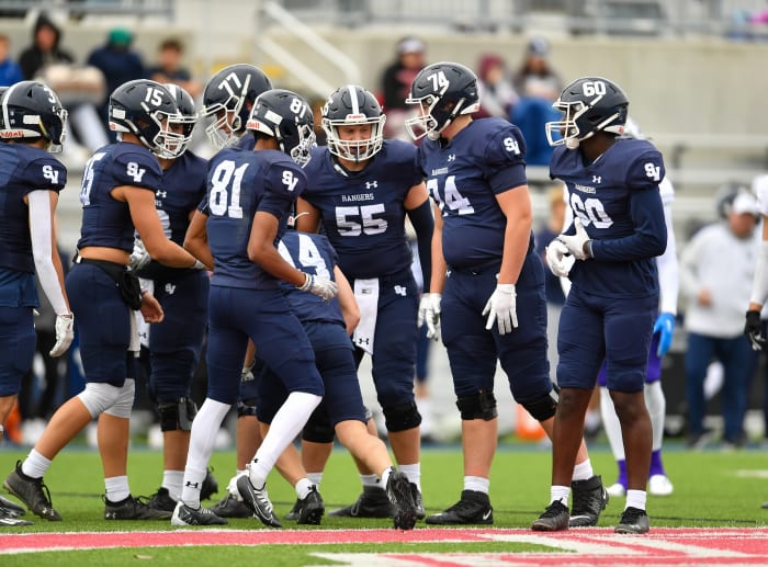 Smithson Valley huddles during the 2022 UIL state playoffs.